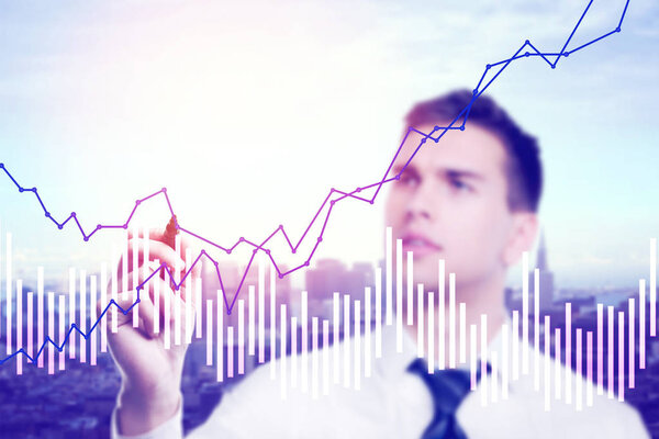 depositphotos_169720012-stock-photo-businessman-drawing-business-chart-on