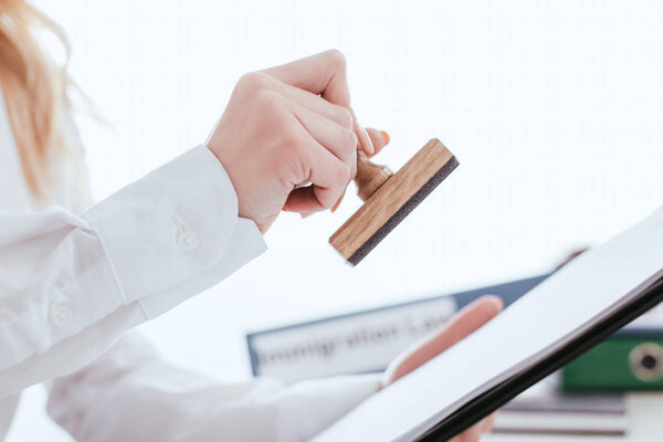 depositphotos_236469968-stock-photo-selective-focus-female-lawyer-holding